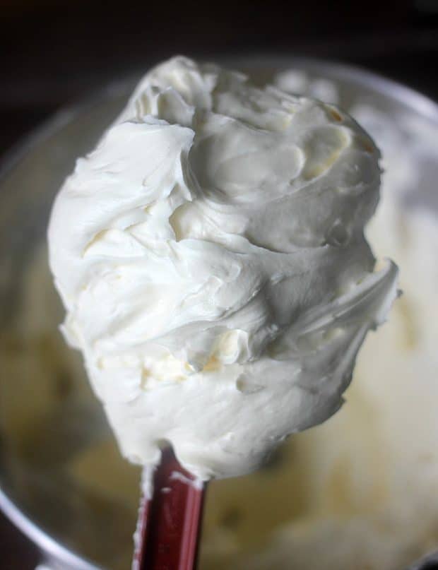 Soft fluffy frosting on the end of a spatula