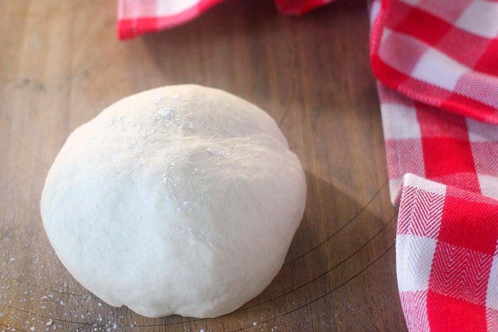 A smooth pizza dough ball after being kneaded