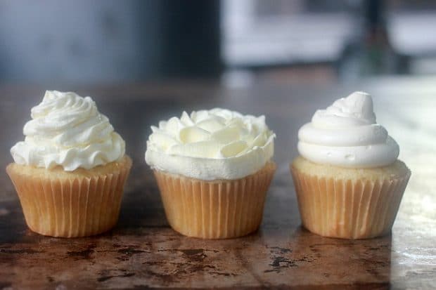 3 cupcakes topped with the best buttercream frosting